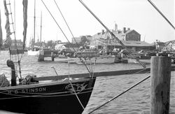 R. B. Stinson tied to Dyer's dock, WHOI dock in background.
