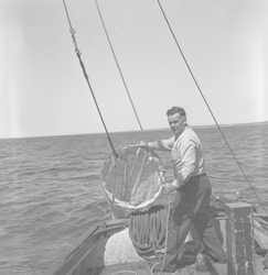 Carl Hayes with a plankton net aboard Asterias.