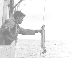 David Rounbehler with water sampler over the side of Gosnold