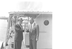 Adm. Edward Smith shaking hands with unidentified man