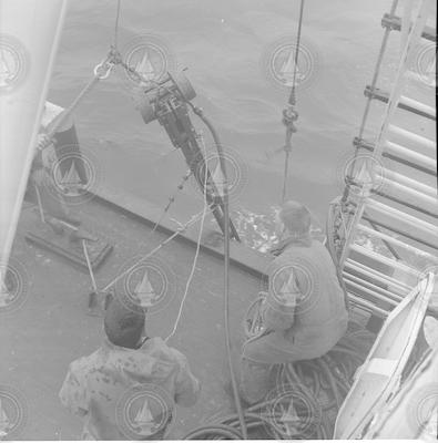Hydraulic corer going into water from deck of Bear