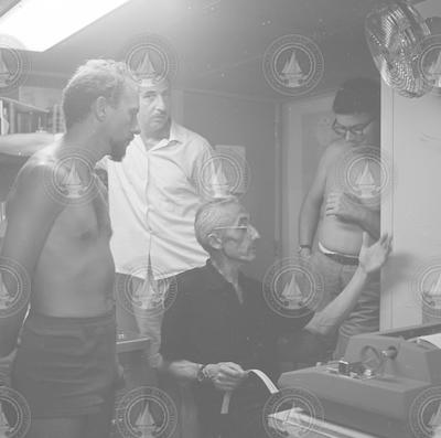 Cooper, Hiller, Cousteau and unidentified person on the Atlantis II.