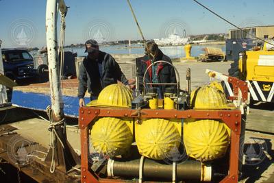 Hardhat flotation packages undergoing testing at the WHOI dock.