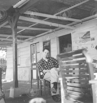 Arthur D. Colburn Jr., sitting on a porch.