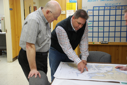 Al Suchy and Eric Benway reviewing proposed channel chart changes.