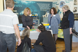 Kathy Patterson showing associates the ocean acidification activity.