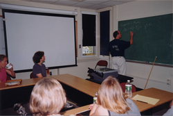 Mike Neubert illustrating his point at the chalkboard.