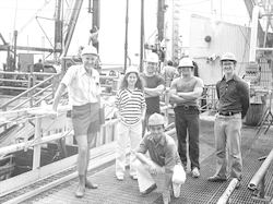 Group on deck of Glomar Challenger in hardhats.