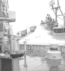 Large wave hitting the side of the USS Hazelwood