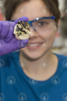 Karin Lemkau holds a peice of a oil covered plate.