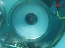 Jefferson Grau peering out from an Alvin viewport window.