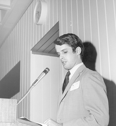 Robert Knox standing at podium