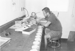 Man working in lab aboard the Anton Bruun