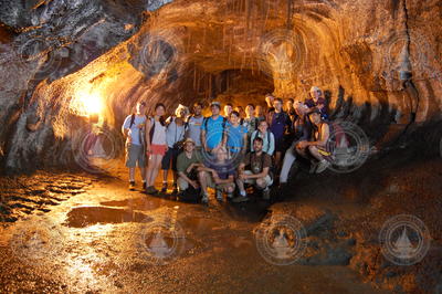 Geodynamics Program group photo in a volcano tunnel in Hawaii.