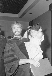 Andy Jahn and child at Commencement