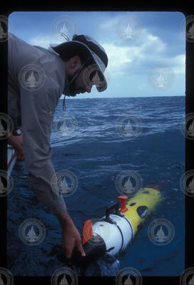 Andrey Scherbina prepares to launch REMUS from the boat.