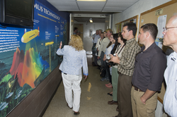 Kathy Patterson leading state officials and OPET members on a WHOI tour.