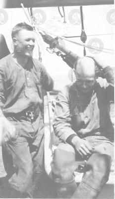 David M. Owen (right) and unidentified crewman
