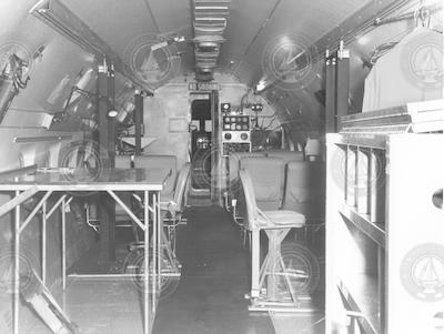 Interior view of C54Q aircraft, seats and work table in view