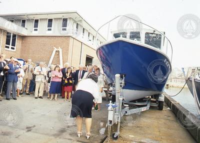 Cynthia Dorman (center) christening the WHOI research boat Mytilus.