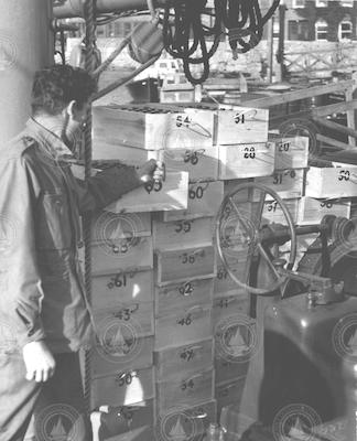 Gene Krance and crates of water sample bottles