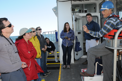 Sandy Williams (right) talking with OSJ fellows and WHOI staff.