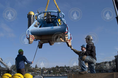 Loading Multi-function Node (MFN) onto R/V Wecoma for mooring tests.