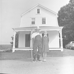 Gracie Witzell and Bill Dunkle in front of Walsh Cottage.