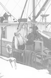 Two men on deck of Anton Dohrn in the winter