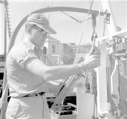 Unidentified man working with a Nansen water sampling bottle.