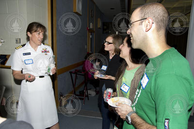 Captain Heidemarie Stefanyshyn-Piper talking with reception guests.