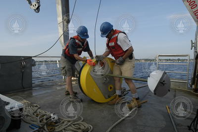 Postdoctoral scholar Dave Ralston and Jay Sisson with a recovered mooring.