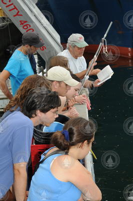 George Hampson (in cap) discussing jellyfish sighting with students.