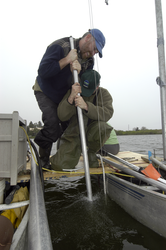 Jeff Donnelly and Dana MacDonald recovering a core in Oyster Pond.