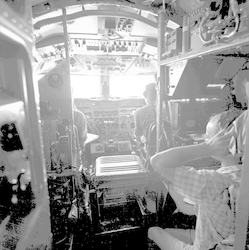Flight Deck of C54Q aircraft - Radio Operator Frank Matthews in foreground