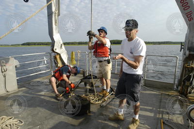 Dave Ralston and Jay Sisson examine a recovered tripod.