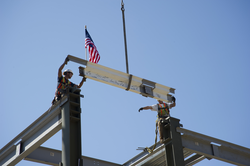 Final LOSOS steel beam placement, beam is signed and installed.