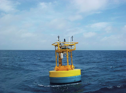 Surface buoy with filter carousel mounted on it collecting airborne particles.