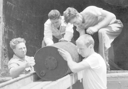 Joe Worzel and others unloading depth charges