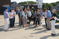 Rob Munier leading the NSF tour group out on the WHOI dock.