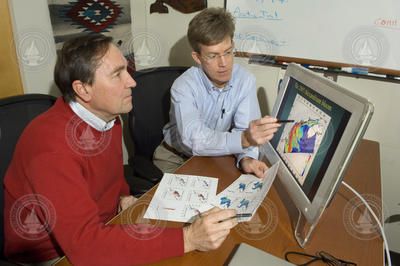 Don Anderson and Dennis McGillicuddy reviewing models.