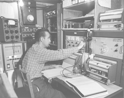 Carl Bowin in main lab aboard Chain with first sea-going computer.