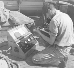 Gene Krance on deck of Atlantis with GEK equipment.