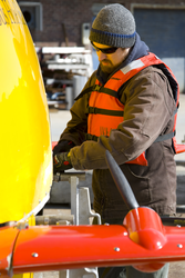 Sean Kelley preparing Sentry for launch at the WHOI dock.