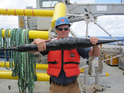 Jim Dunn holds a NOMAD buoy mooring line.