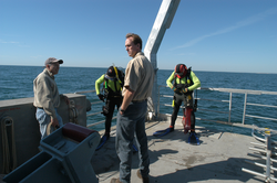 John Trowbridge, left, and Ken Houtler, right, on deck of Tioga with divers.