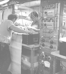 John Connell (left) working on equipment in Atlantis II computer lab