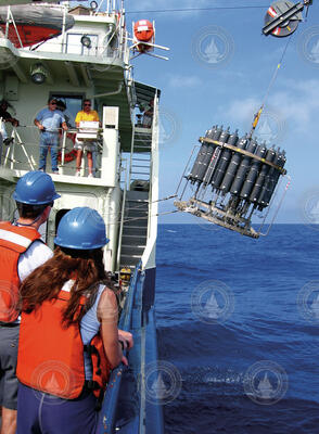 Water sampling rosette with CTD is deployed off R/V Oceanus.