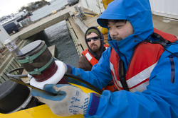 Sean Kelley and Justin Fujii preparing AUV Sentry for dock tests.