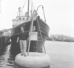 Bill Richardson on buoy in front of R/V Bear.